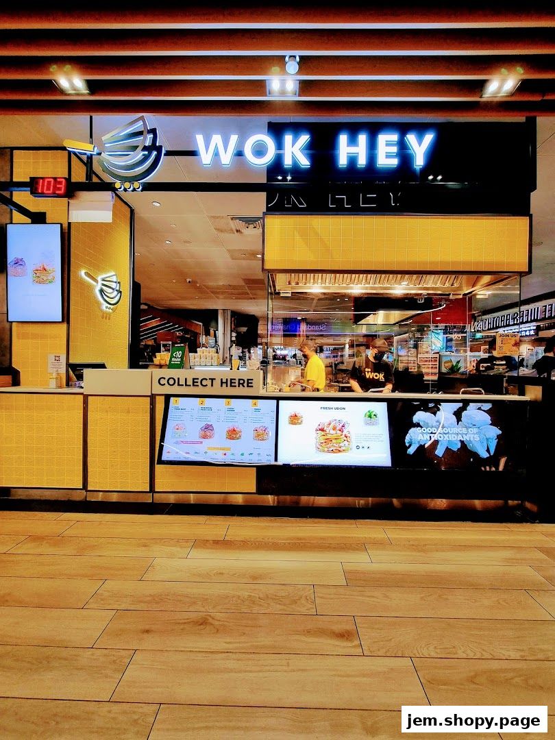 The Wok Hey shop front displays a digital menu and a 'Collect Here' sign.