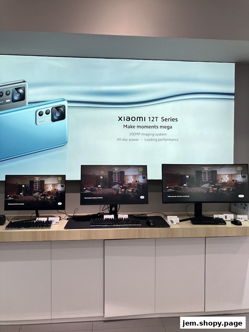 Xiaomi 12T Series phones displayed with promotional screens and monitors.