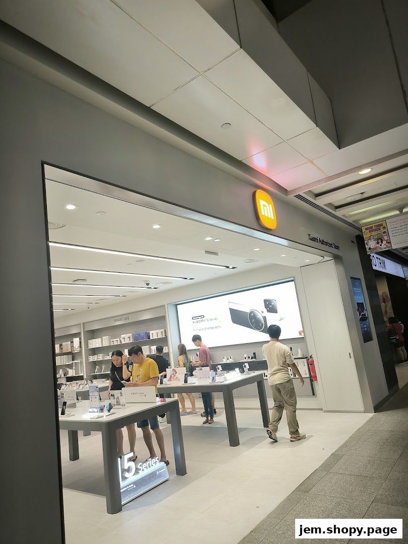 Interior view of a Xiaomi Authorized Store with customers browsing products.