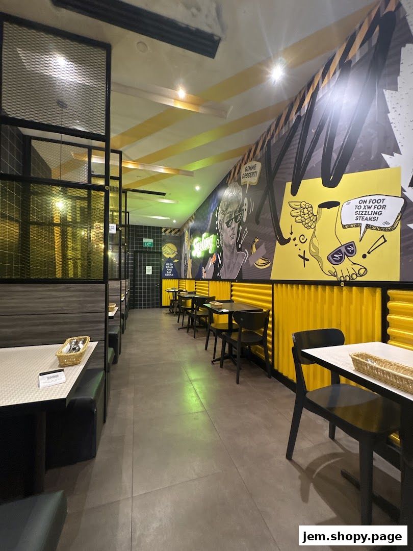 Interior view of XW Western Grill with booth seating and vibrant wall art.