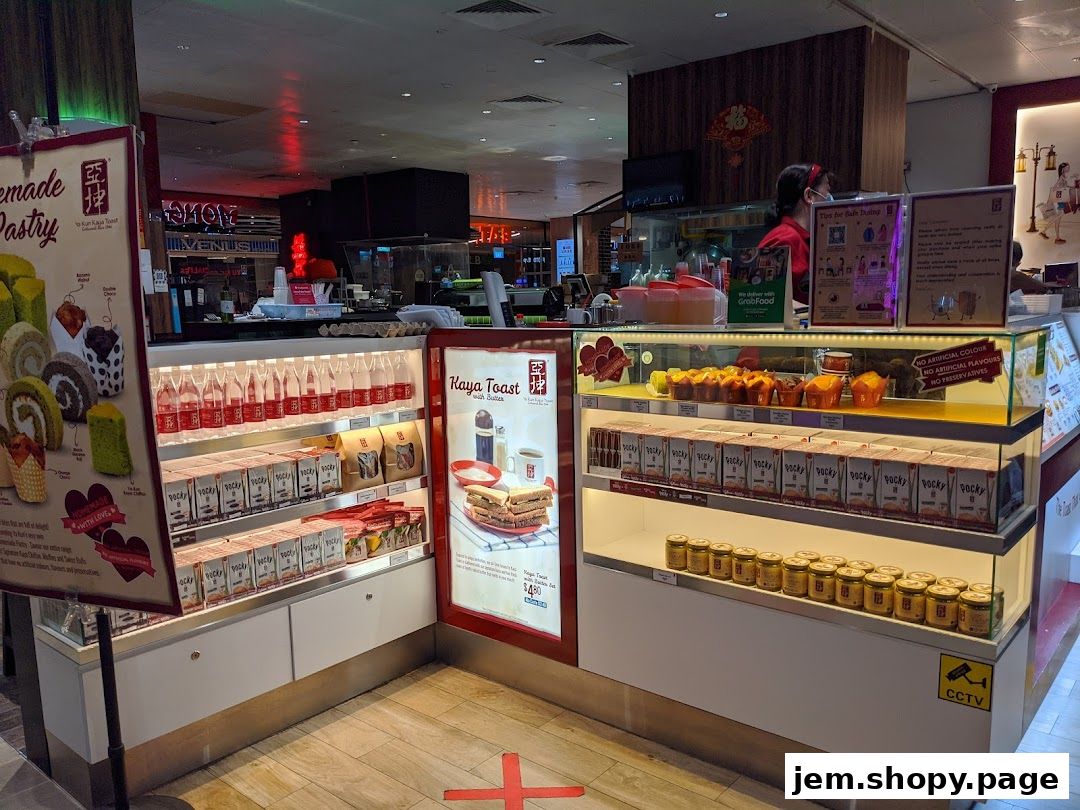 Ya Kun Kaya Toast shop display featuring pastries, kaya jars, and Pocky snacks.