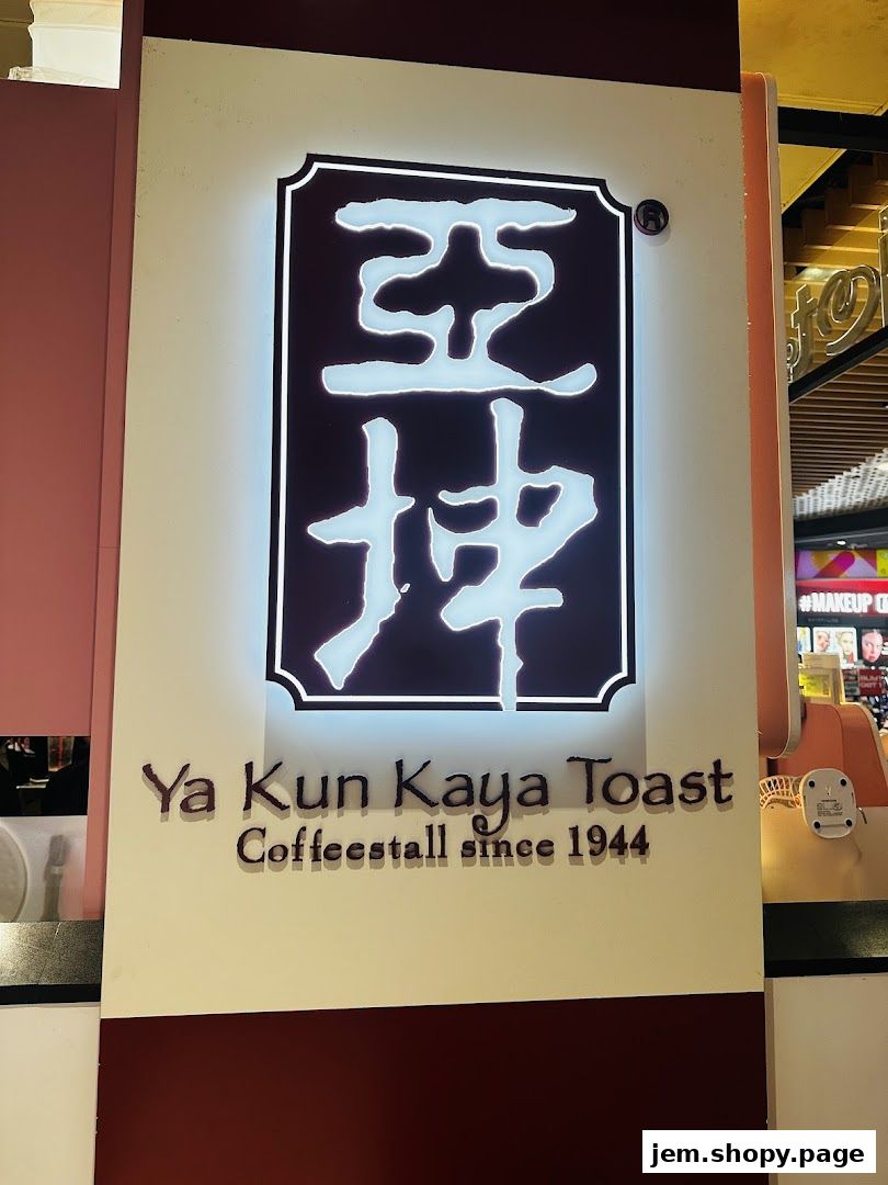 The illuminated sign for Ya Kun Kaya Toast, a coffee stall established in 1944.