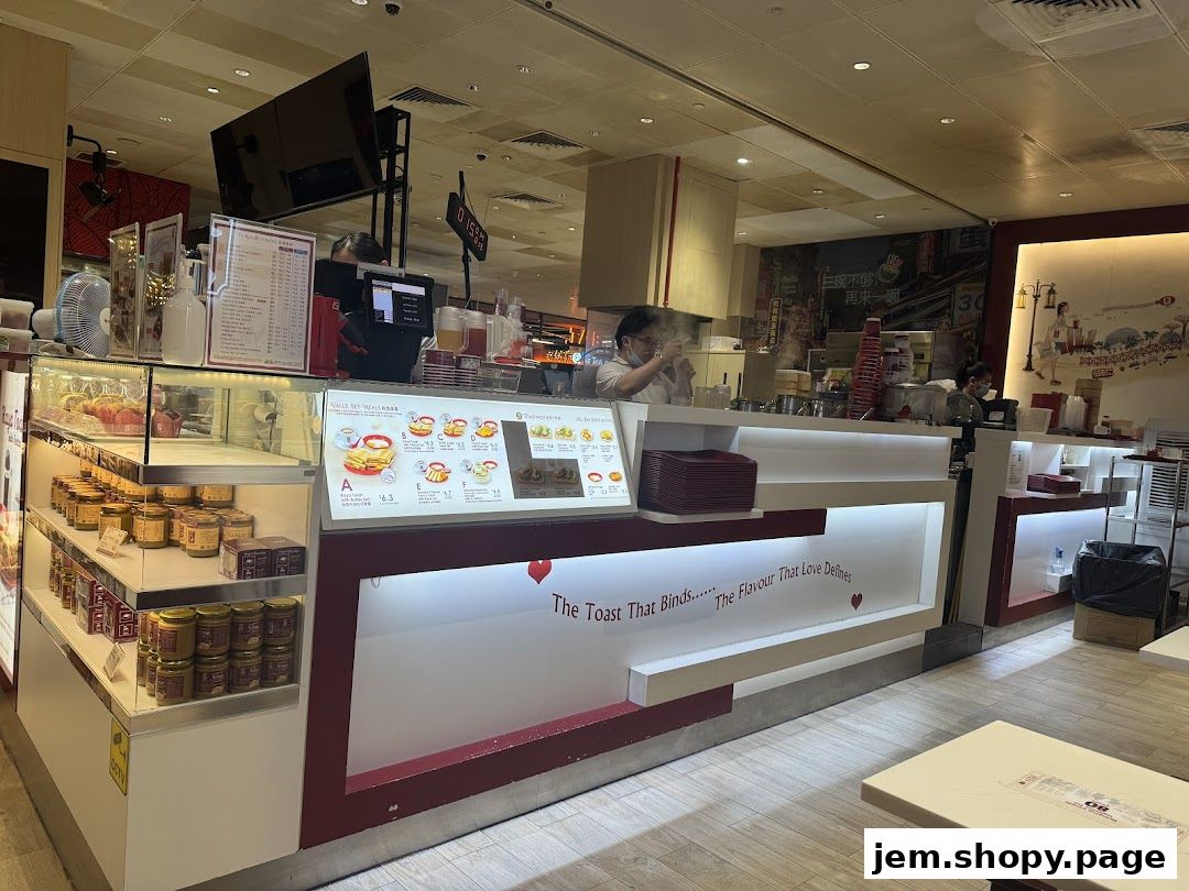 Interior view of Ya Kun Kaya Toast with display shelves and counter service.