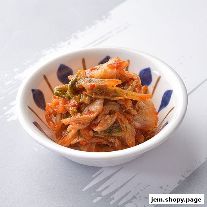 A small bowl of spicy Korean kimchi served in a decorative dish.