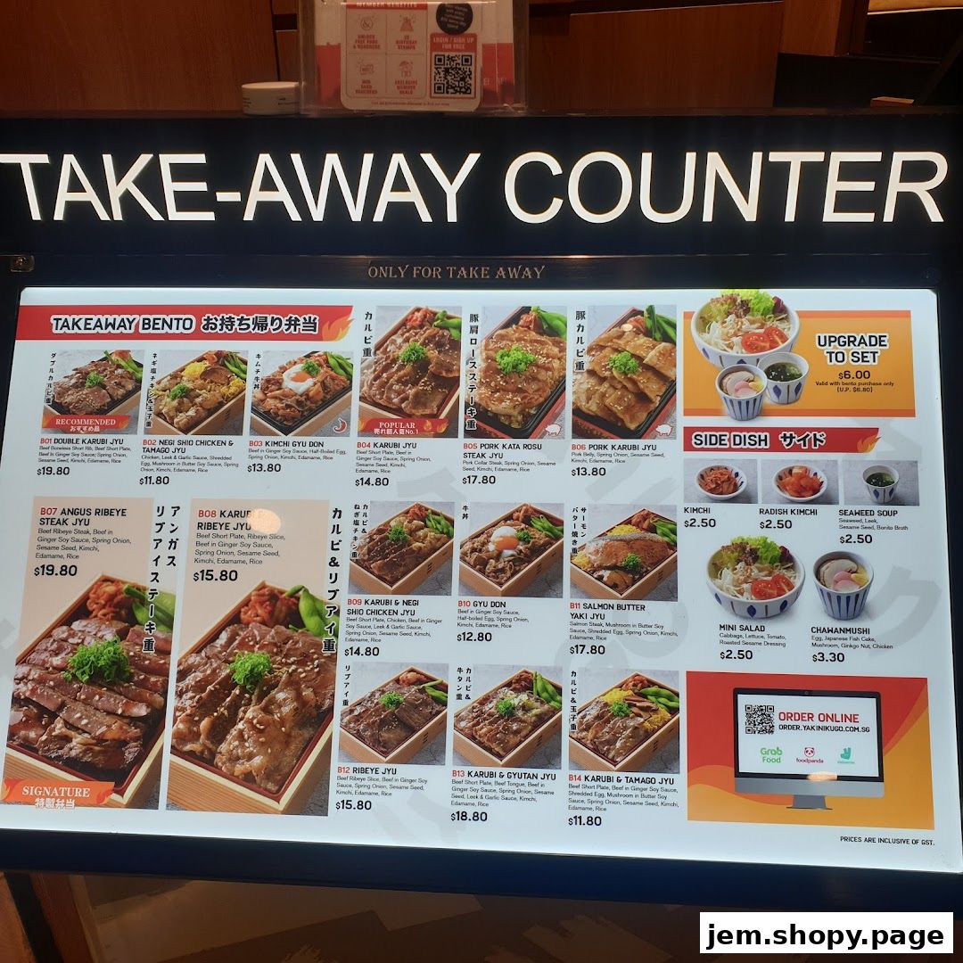A take-away counter menu displaying various bento boxes and side dishes with prices.
