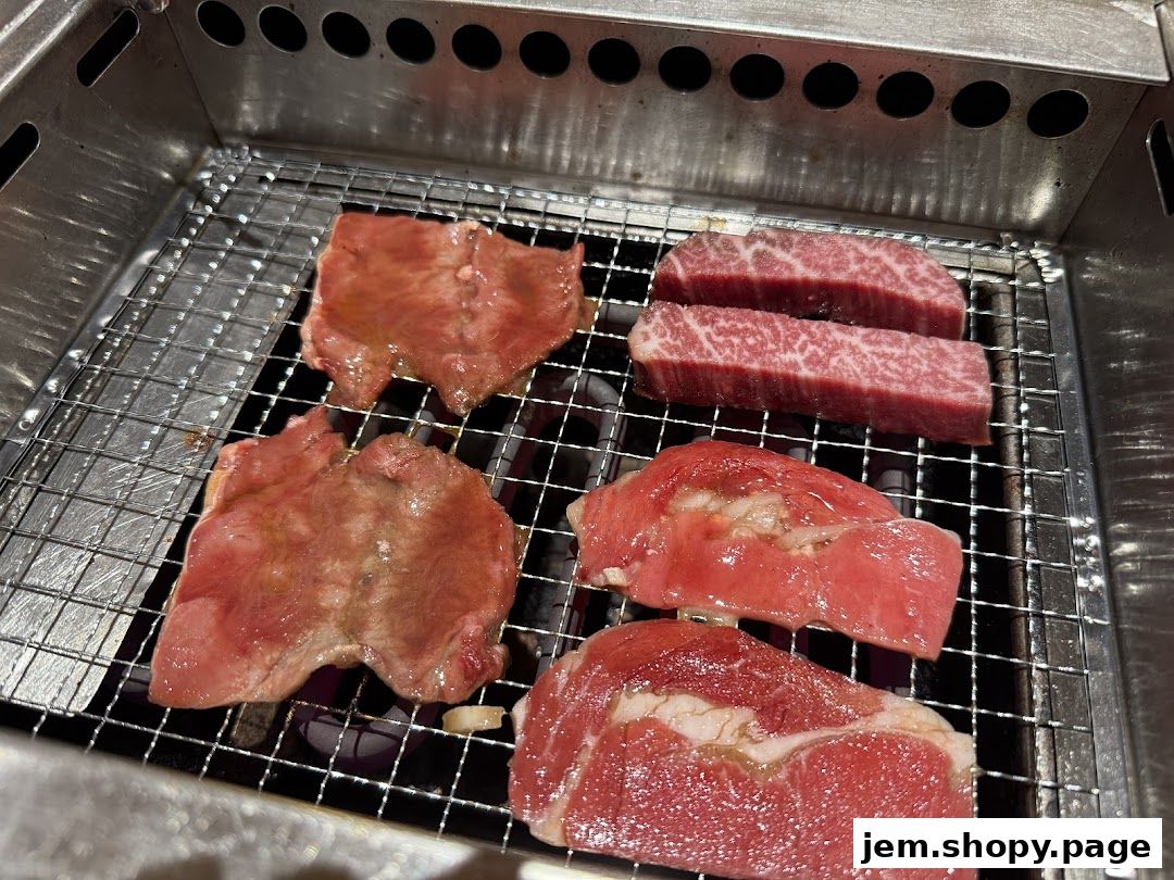 Sizzling cuts of raw beef are grilling on a metal grate over hot coals.