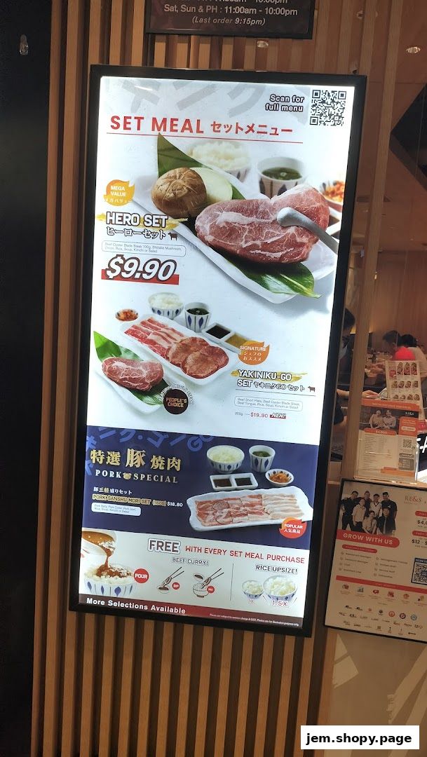 A menu board displays set meals for Yakiniku-GO, featuring beef and pork options with prices.