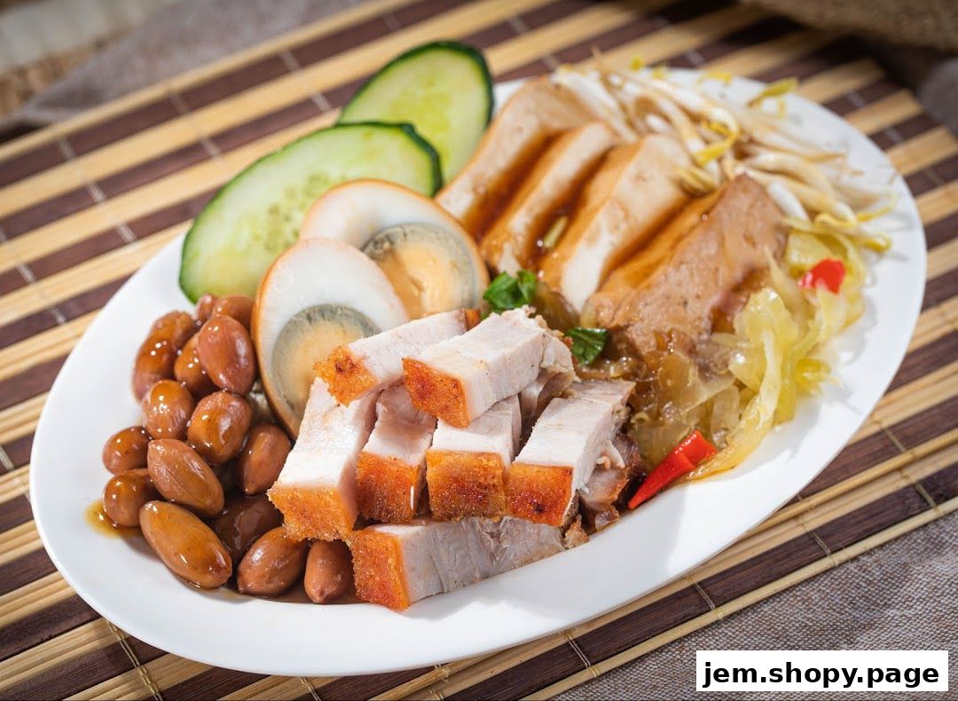 A plate of braised pork belly, braised eggs, peanuts, tofu, and pickled vegetables.