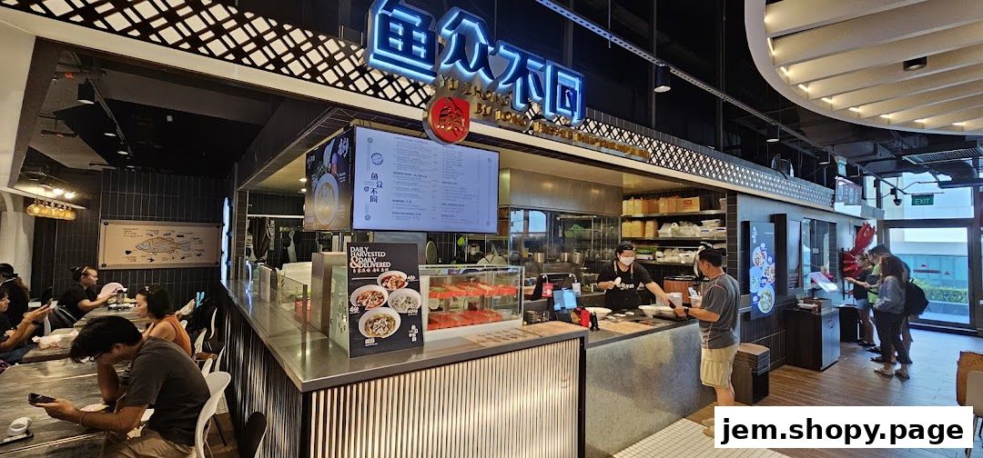 Interior view of a modern seafood restaurant with customers and staff at the counter.
