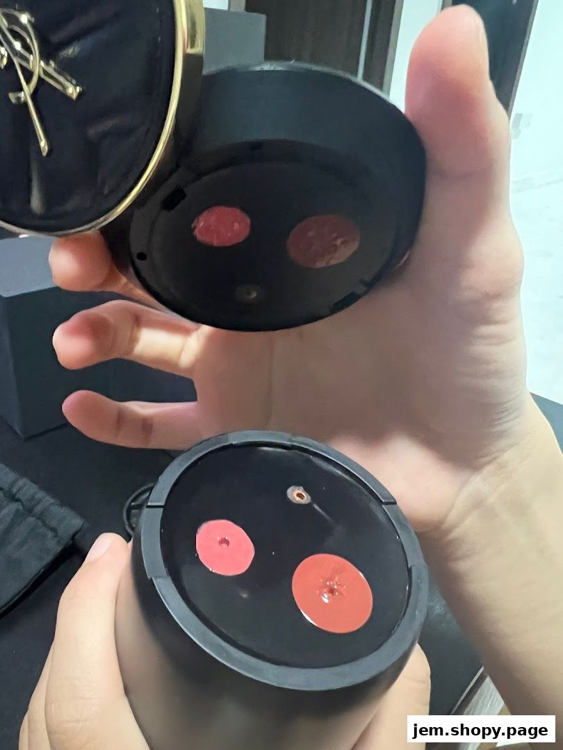 Hands holding YSL makeup compacts with visible lipstick shades.