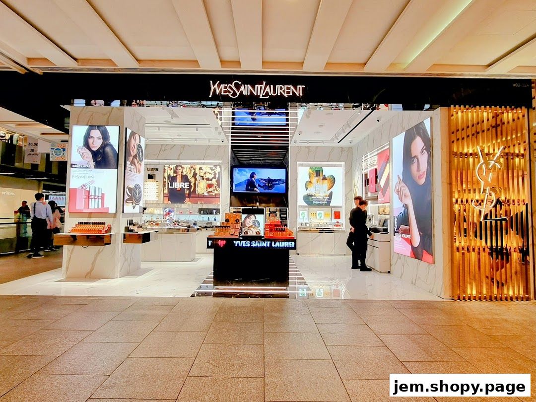 The elegant Yves Saint Laurent store entrance showcases beauty products and brand imagery.