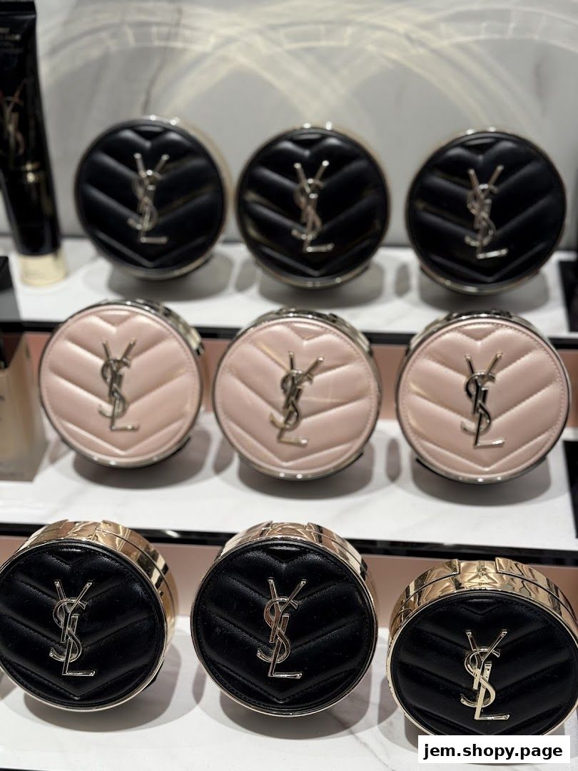 YSL compact makeup products displayed in black and pink packaging.