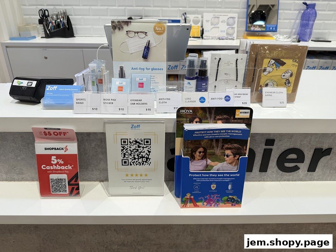 A display of eyewear accessories and promotional materials at Zoff Jem.