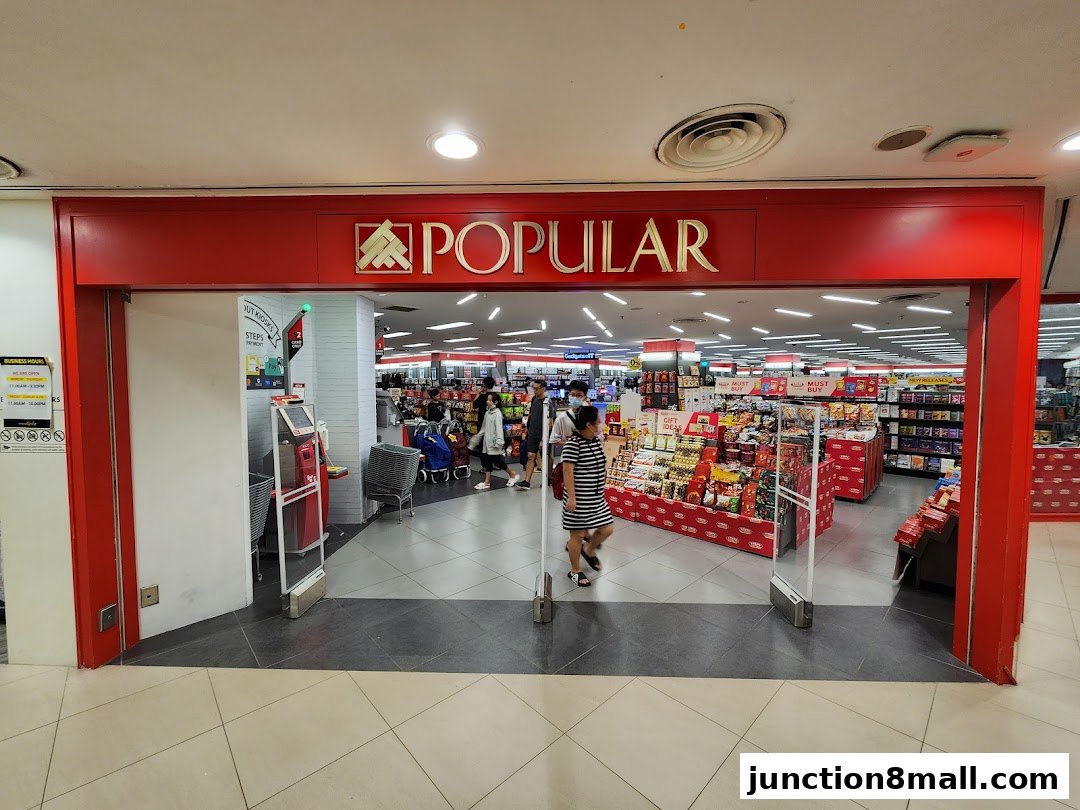 The entrance to a POPULAR Bookstore, showcasing a wide selection of books and merchandise.