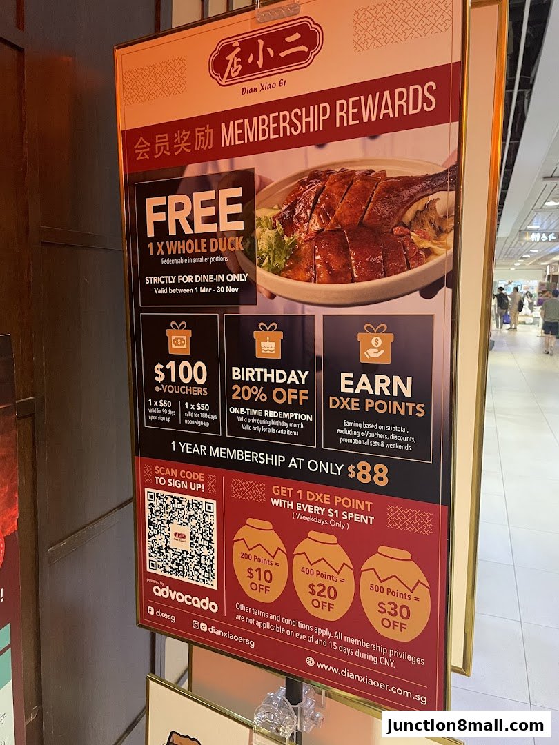 A promotional poster for Dian Xiao Er's membership rewards program, featuring a whole roasted duck.