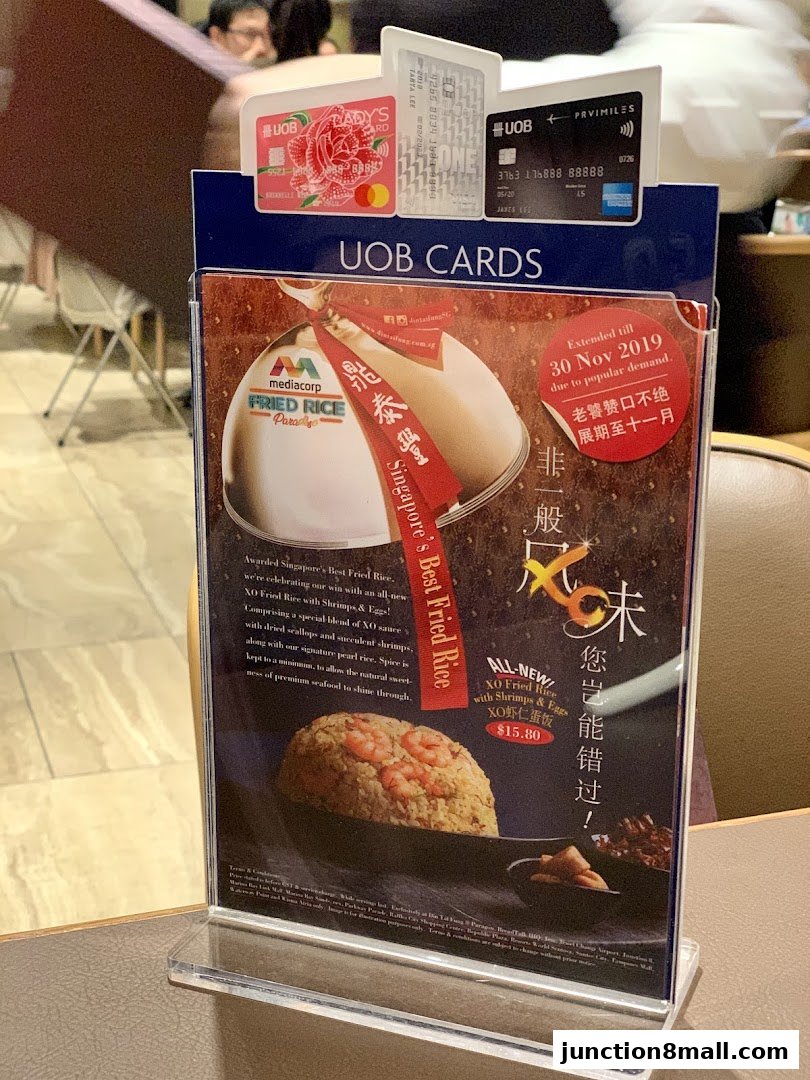 A promotional flyer for Din Tai Fung's XO Fried Rice with Shrimps & Eggs, featuring UOB card promotions.