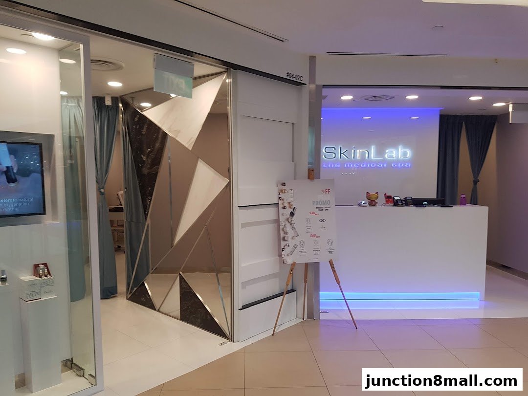 The entrance to SkinLab The Medical Spa, featuring a modern reception and promotional signage.