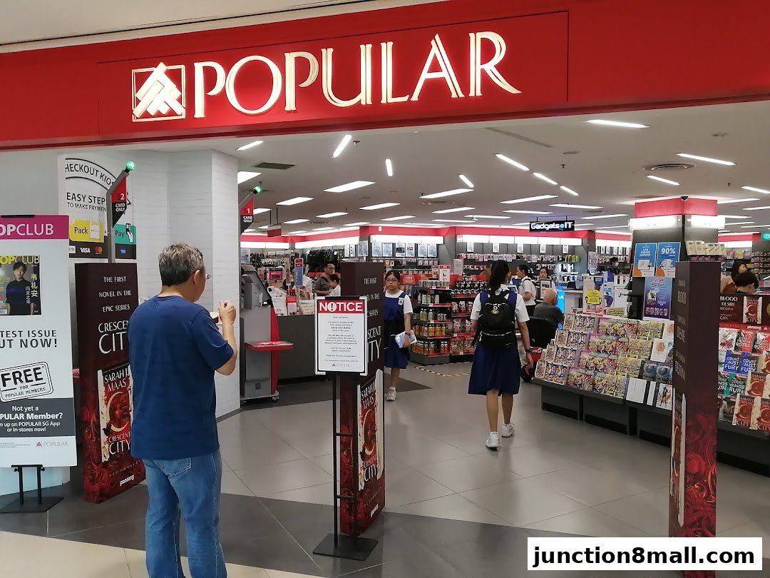 The entrance of POPULAR Bookstore with customers browsing inside.