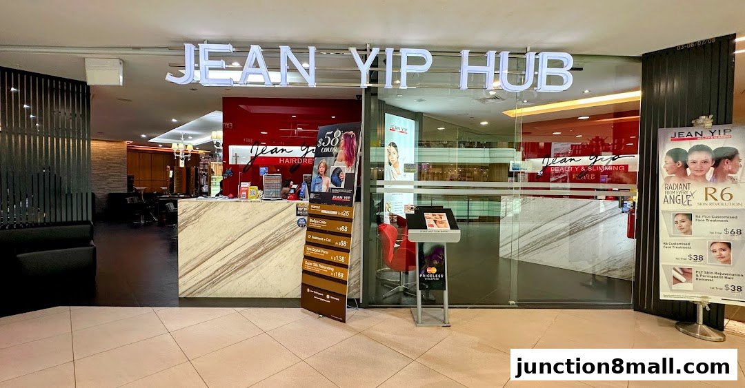 The entrance of Jean Yip Hairdressing Hub, showcasing services and promotions.