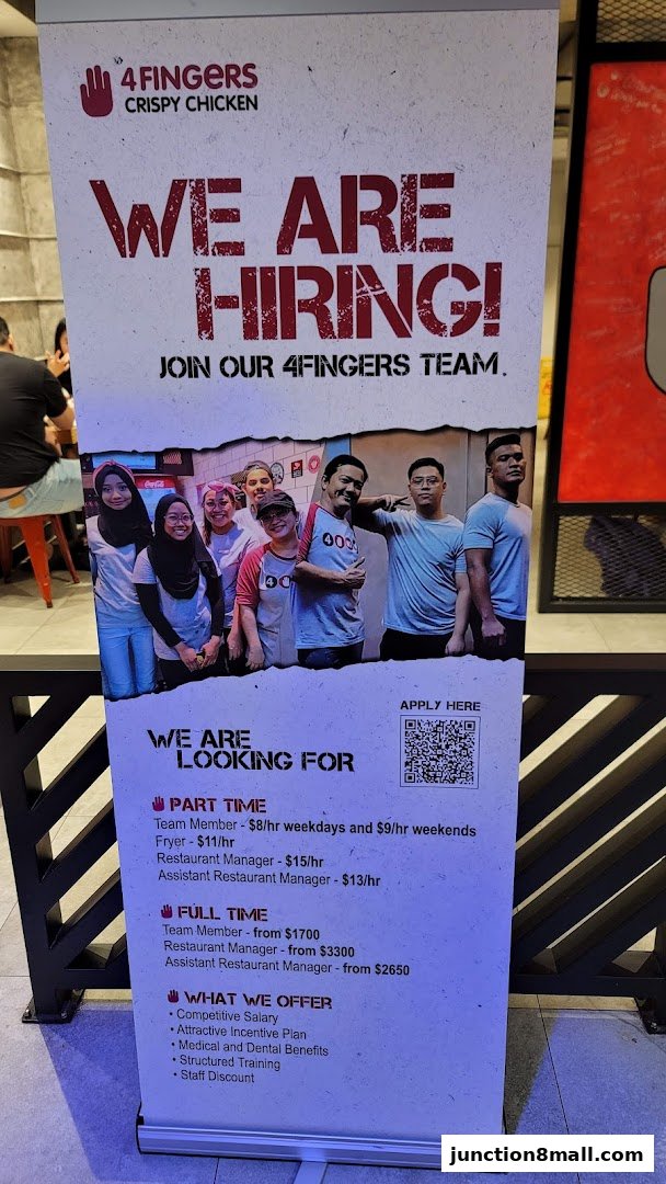 A recruitment banner for 4 Fingers Crispy Chicken, showcasing staff and job opportunities.