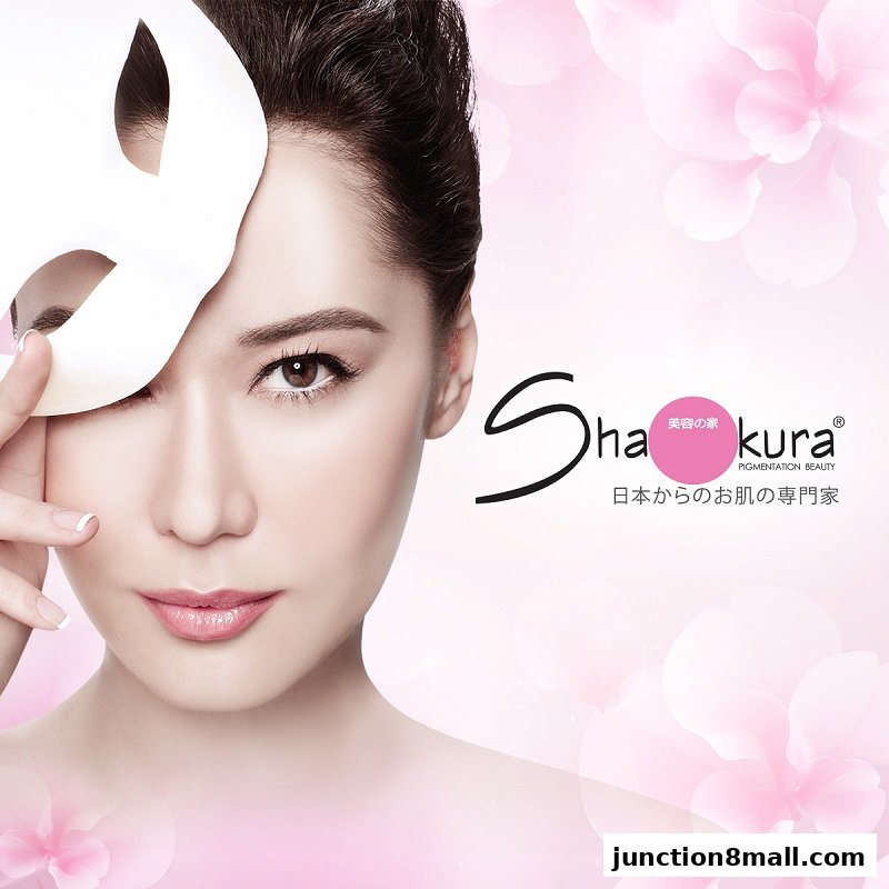 A woman with a mask covering part of her face, promoting Shakura Pigmentation Beauty.