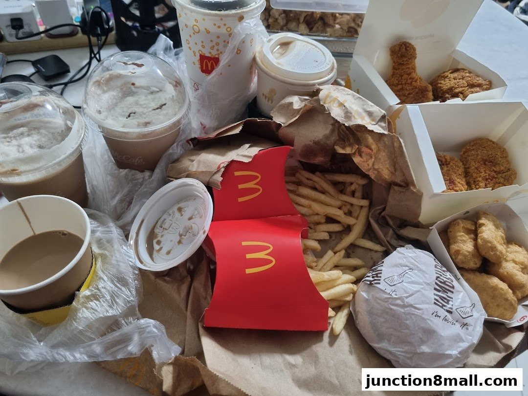 A collection of McDonald's food items including fried chicken, fries, nuggets, burgers, and drinks.