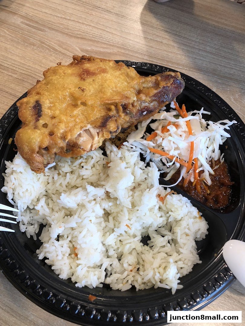 A plate of fried fish, rice, and coleslaw from Long John Silver's.