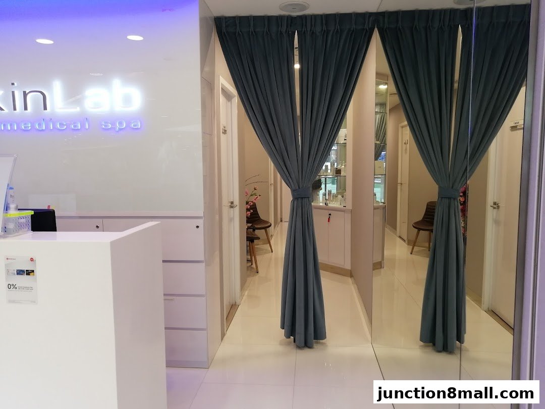 The reception area and hallway of a medical spa with a prominent 'SkinLab' sign.