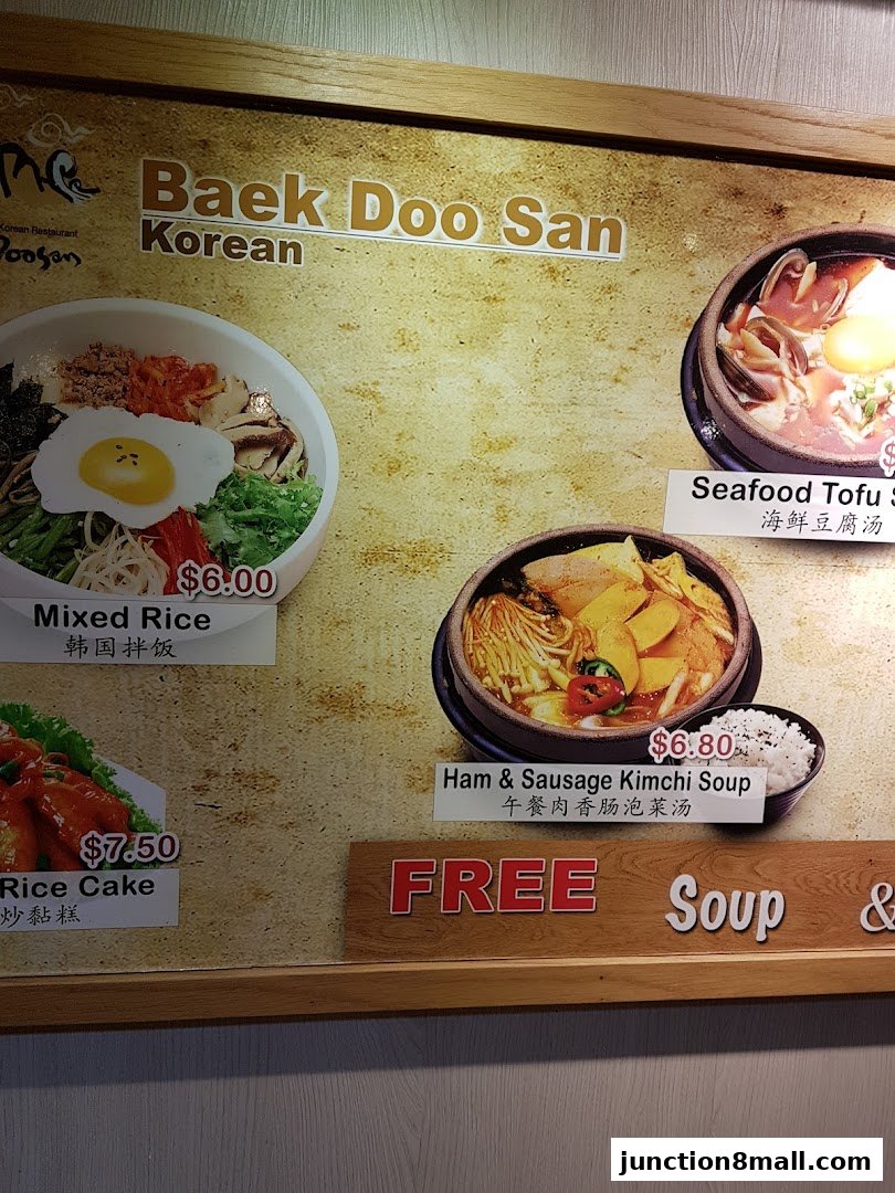 A menu board for Baek Doo San Korean restaurant featuring various Korean dishes with prices.