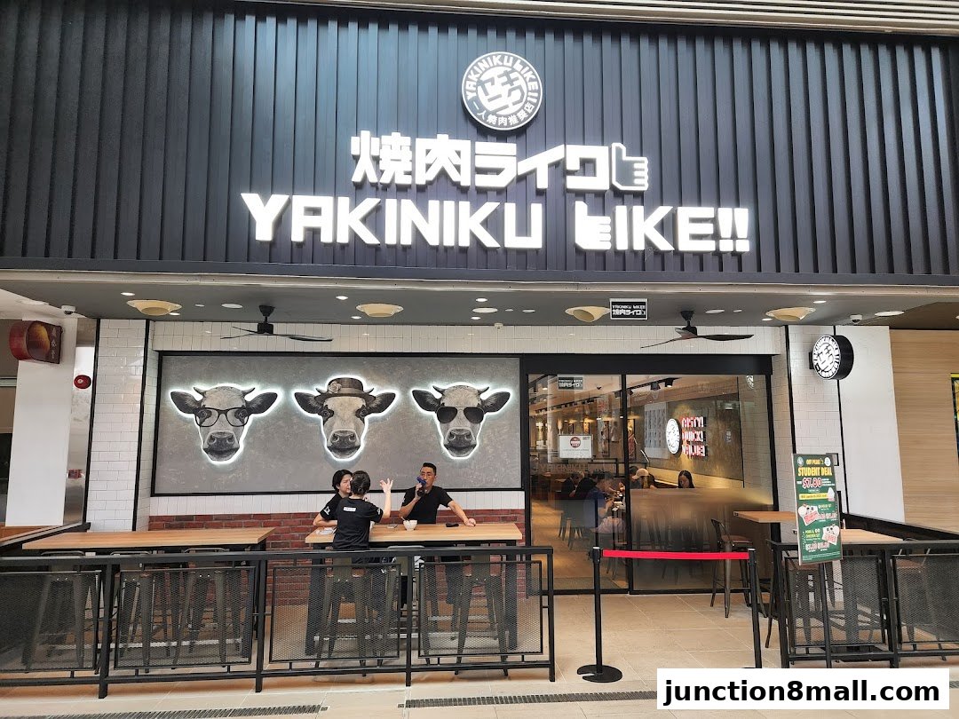The exterior of Yakiniku Like Junction 8 with its prominent signage and cow illustrations.