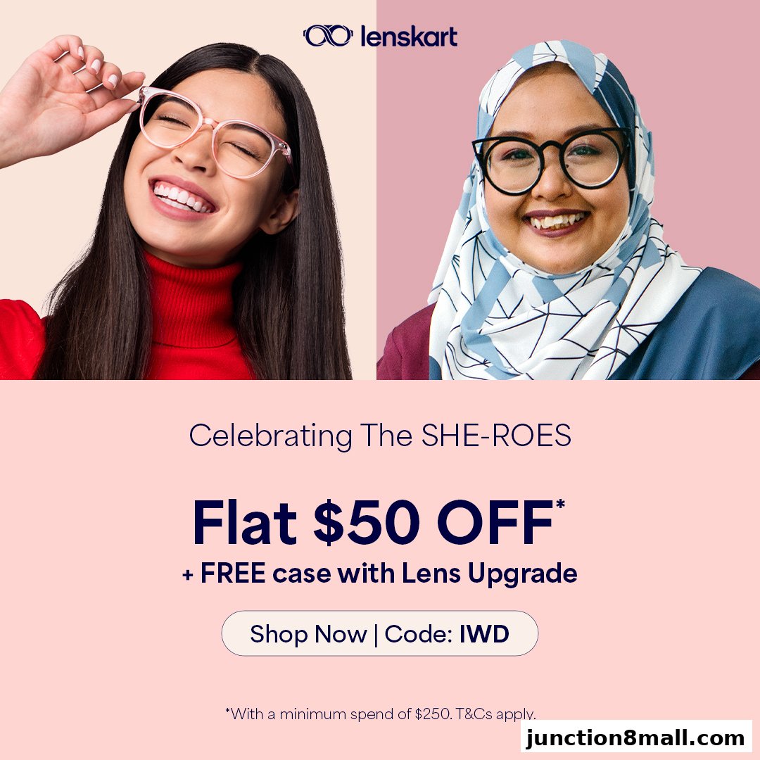 Two women smiling, one wearing pink glasses and the other wearing black glasses and a hijab.