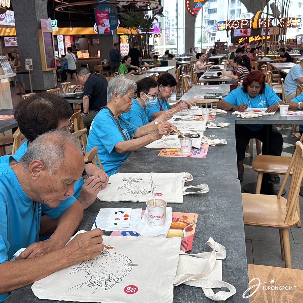 Seniors enjoying a cheerful breakfast at Kopitiam Food Hall.