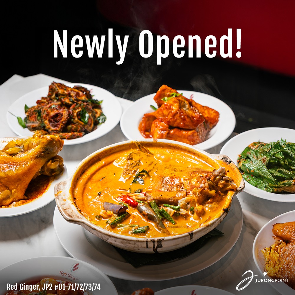 A warm and inviting interior view of the new Red Ginger restaurant at Jurong Point, showcasing comfortable seating and a pleasant dining atmosphere.
