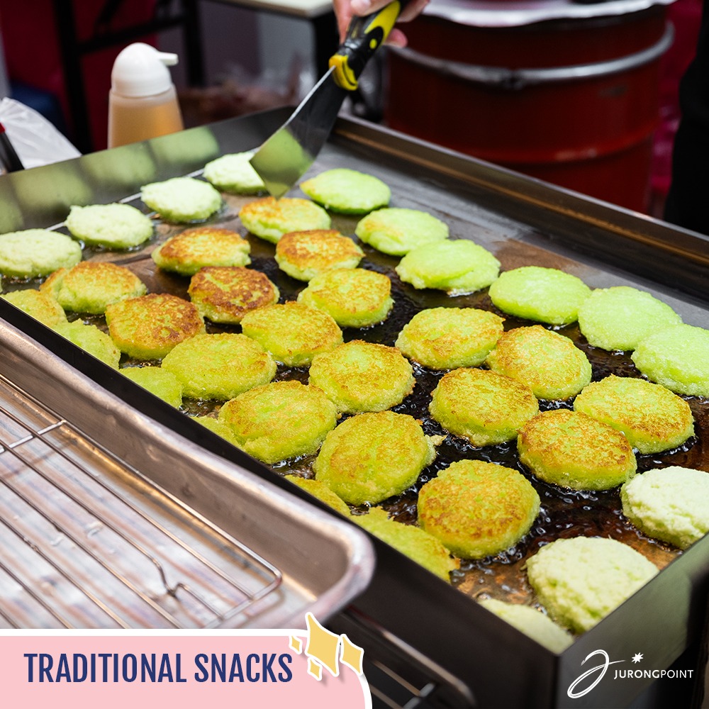 Attendees enjoying the lively atmosphere and culinary offerings at the Deliciously Singapore Fair.