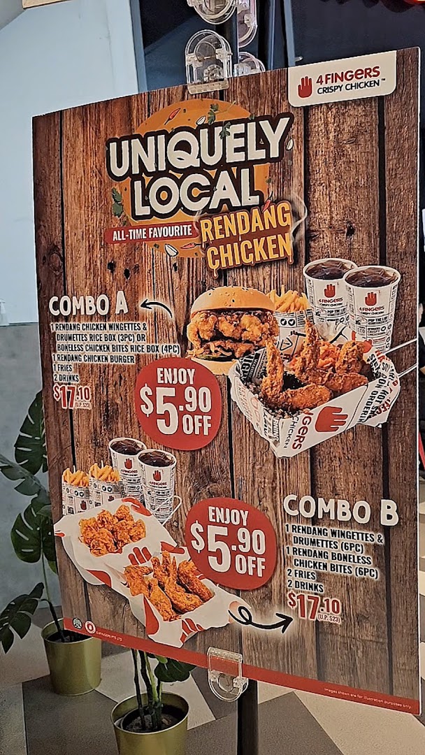 A promotional poster for 4Fingers Crispy Chicken featuring Rendang Chicken combos and special offers.