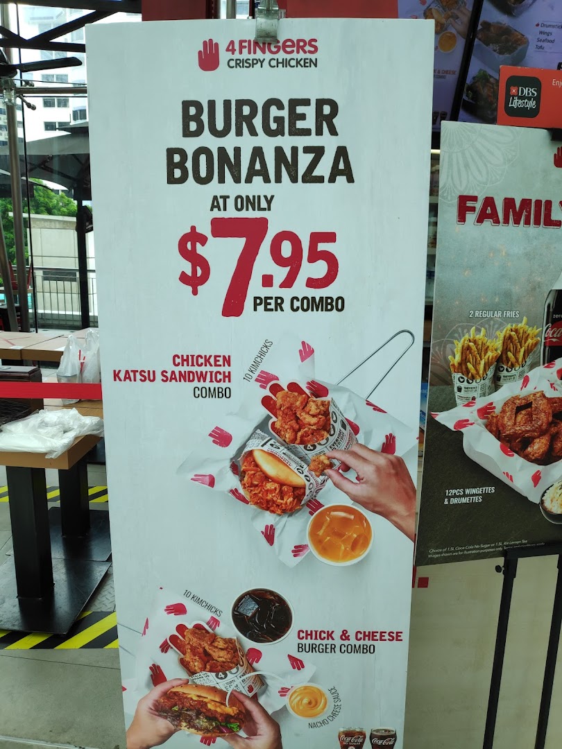A promotional standee for 4Fingers Crispy Chicken's 'Burger Bonanza' featuring combos for $7.95.