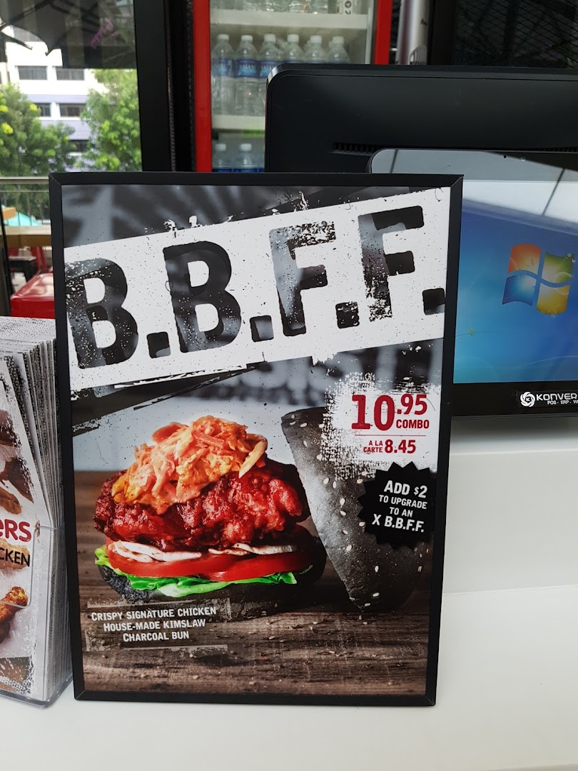 A promotional standee for 4Fingers Crispy Chicken's B.B.F.F. burger, detailing its ingredients and pricing.