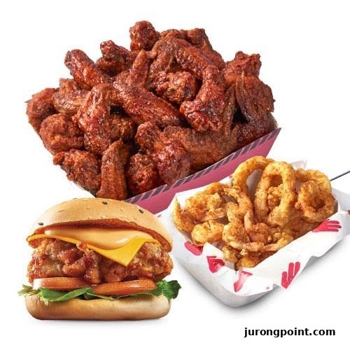 A delicious spread of crispy chicken wings, a chicken burger, and golden onion rings from 4Fingers.
