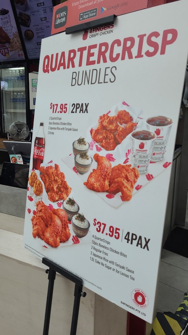 A promotional stand displaying QuarterCrisp Bundles and prices for 4Fingers Crispy Chicken.