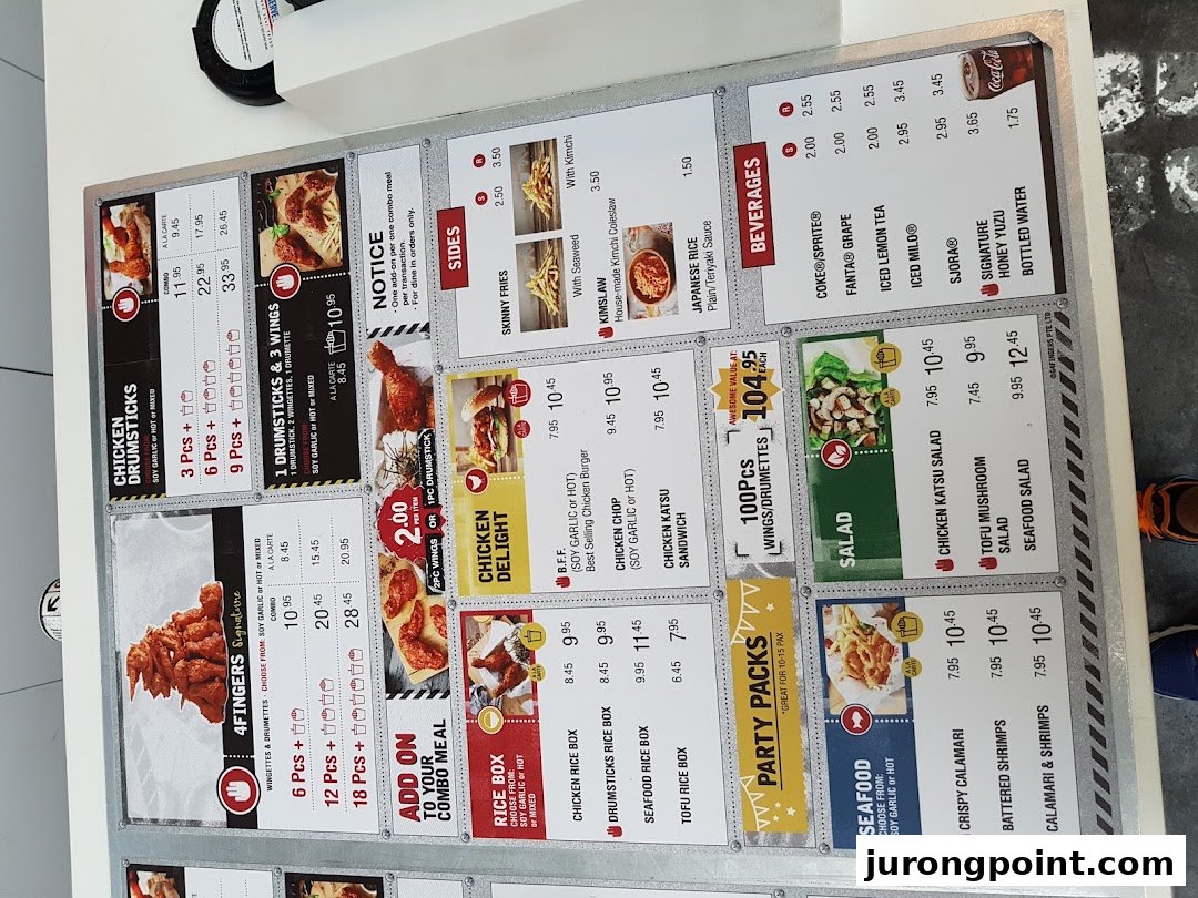 A detailed menu board for 4Fingers Crispy Chicken, showcasing various chicken, seafood, sides, and beverage options.