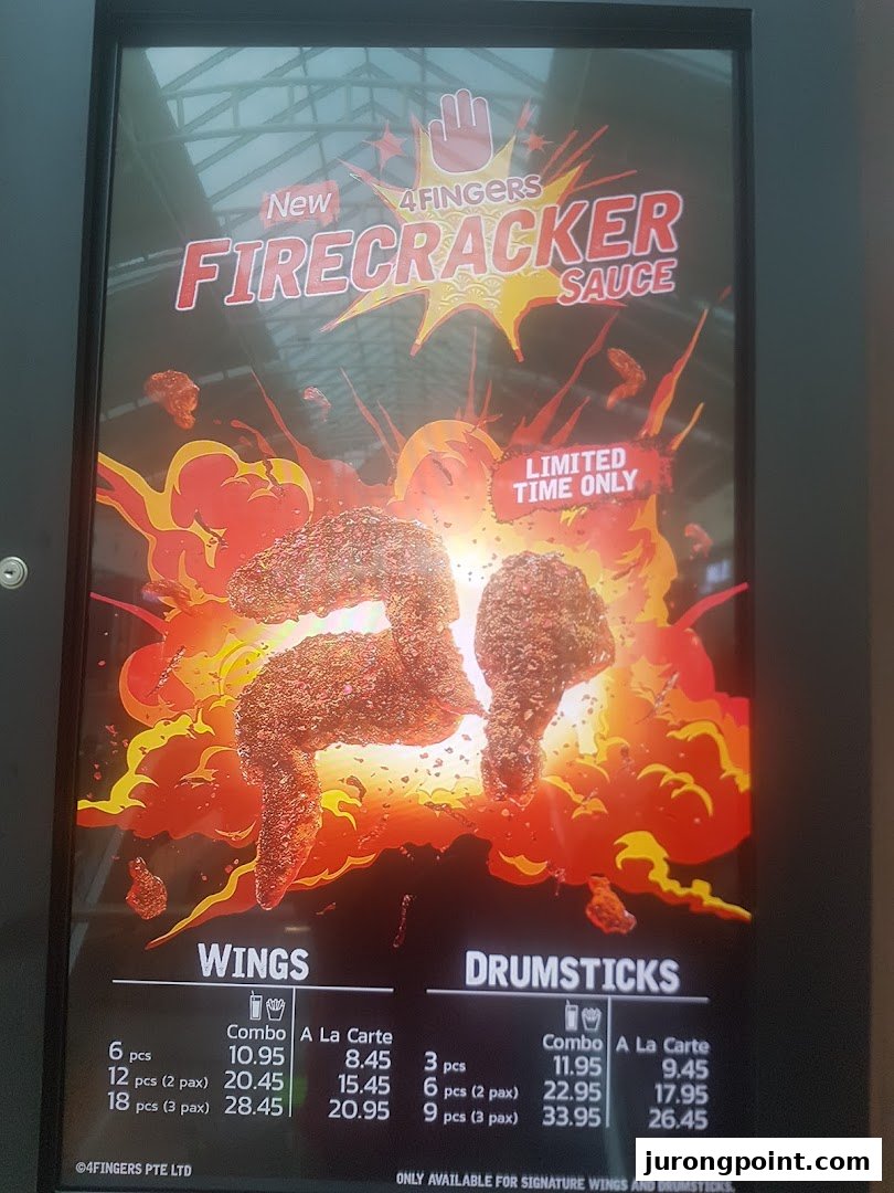 A menu board for 4Fingers Crispy Chicken showcasing their new Firecracker sauce and chicken items.
