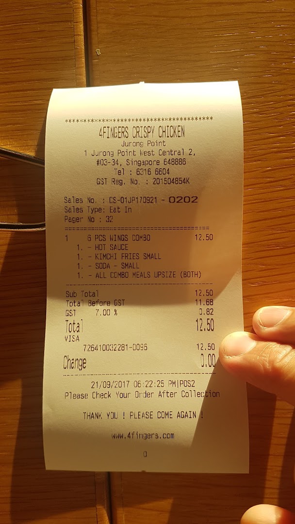 A detailed receipt from 4Fingers Crispy Chicken, showing a combo meal purchase and transaction details.