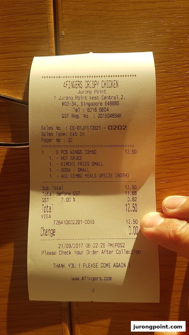 A detailed receipt from 4Fingers Crispy Chicken, showing a combo meal purchase and transaction details.