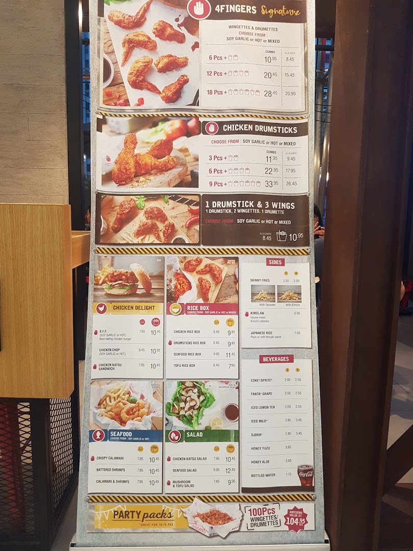A detailed menu board for 4Fingers Crispy Chicken, showcasing various chicken, seafood, and side dishes.