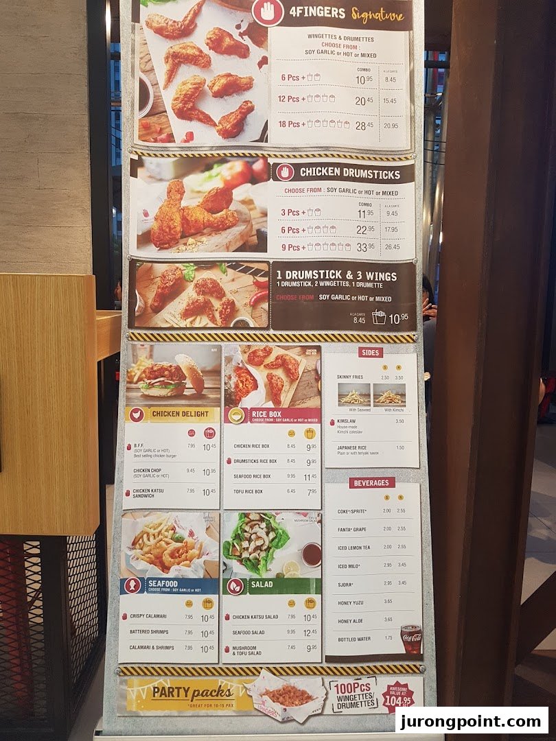 A detailed menu board for 4Fingers Crispy Chicken, showcasing various chicken, seafood, and side dishes.