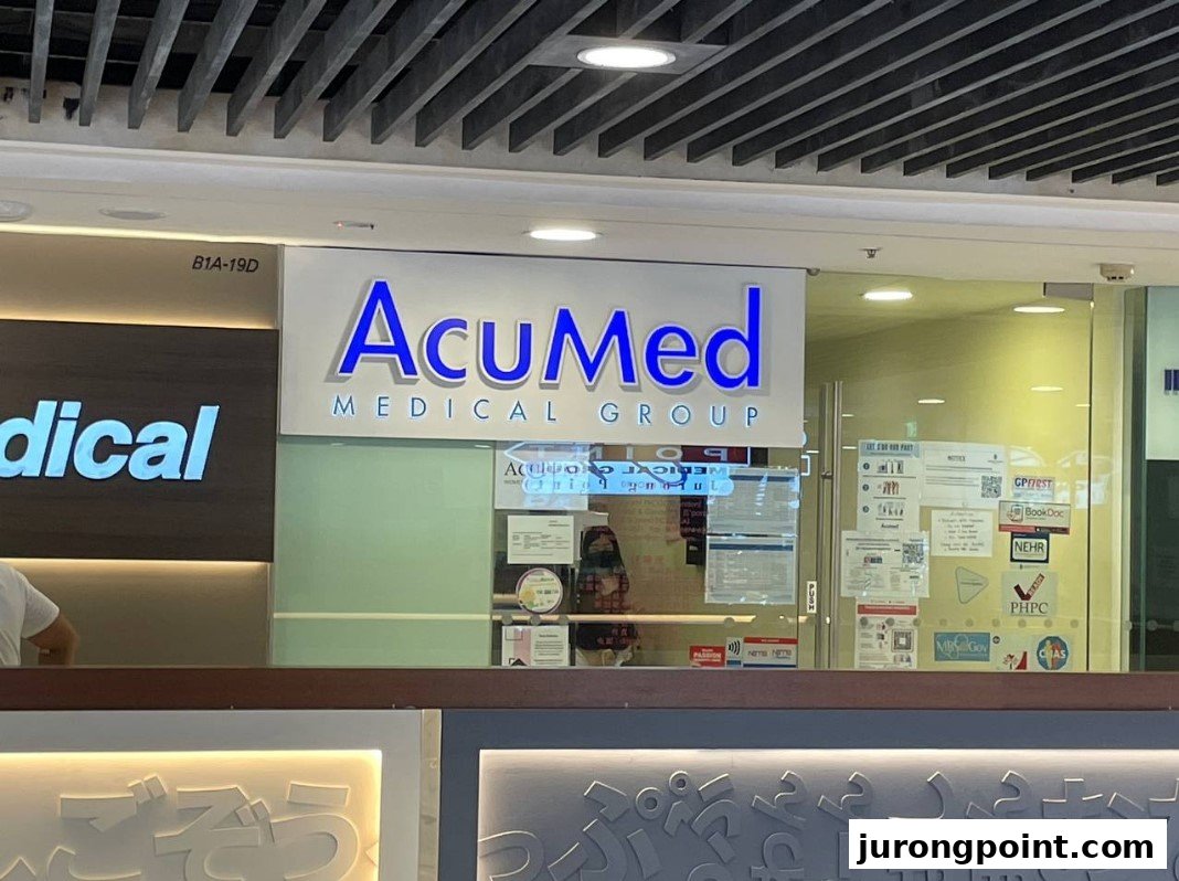 The illuminated entrance sign of AcuMed Medical Group in a shopping mall.