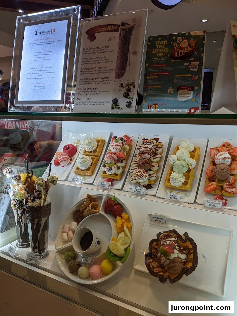 A vibrant display of delicious waffles, sundaes, smoothies, and a fondue set at Andersens of Denmark.
