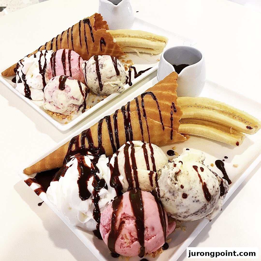 Two dessert plates featuring ice cream scoops, waffle cones, bananas, whipped cream, and chocolate drizzle.