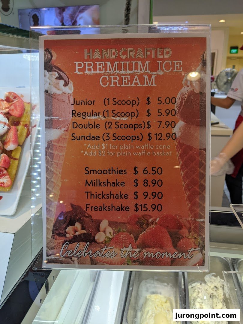 A menu displaying prices for handcrafted premium ice cream, sundaes, smoothies, milkshakes, thickshakes, and freakshakes.