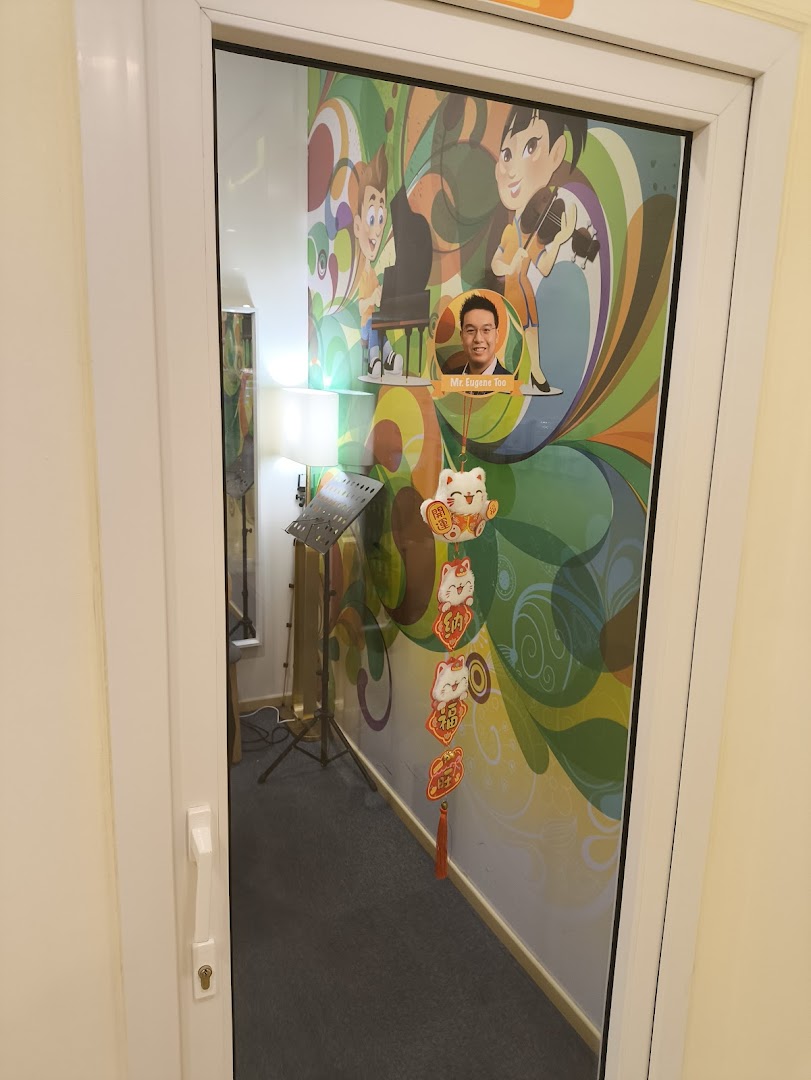 A glass door reveals a vibrant music academy room with colorful wall art and musical instruments.